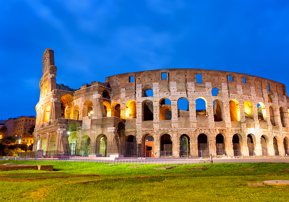 The Colosseum illuminated at dusk in Rome